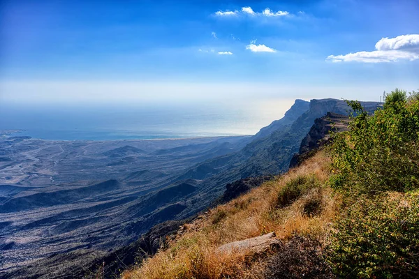 depositphotos_576414592-stock-photo-view-cliff-arabian-sea-oman